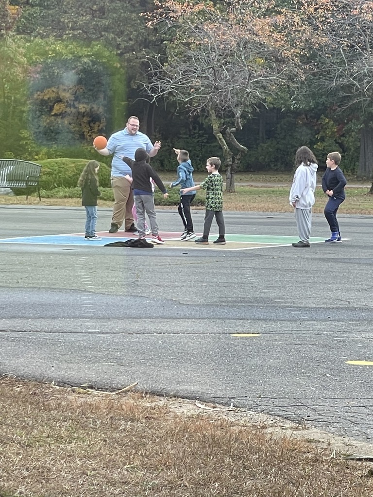 Mr. Rogers playing with his class at recess