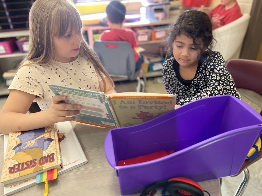 Fourth graders read to kindergarten students